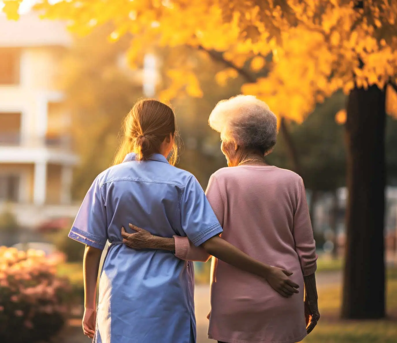 Home Care Services: Nurse and Elderly Woman Walking Together - Symbolizing Caregiver Services and Companionship - Supreme Homecare Photograph of a Nurse Caregiver and Elderly Woman Walking Together.